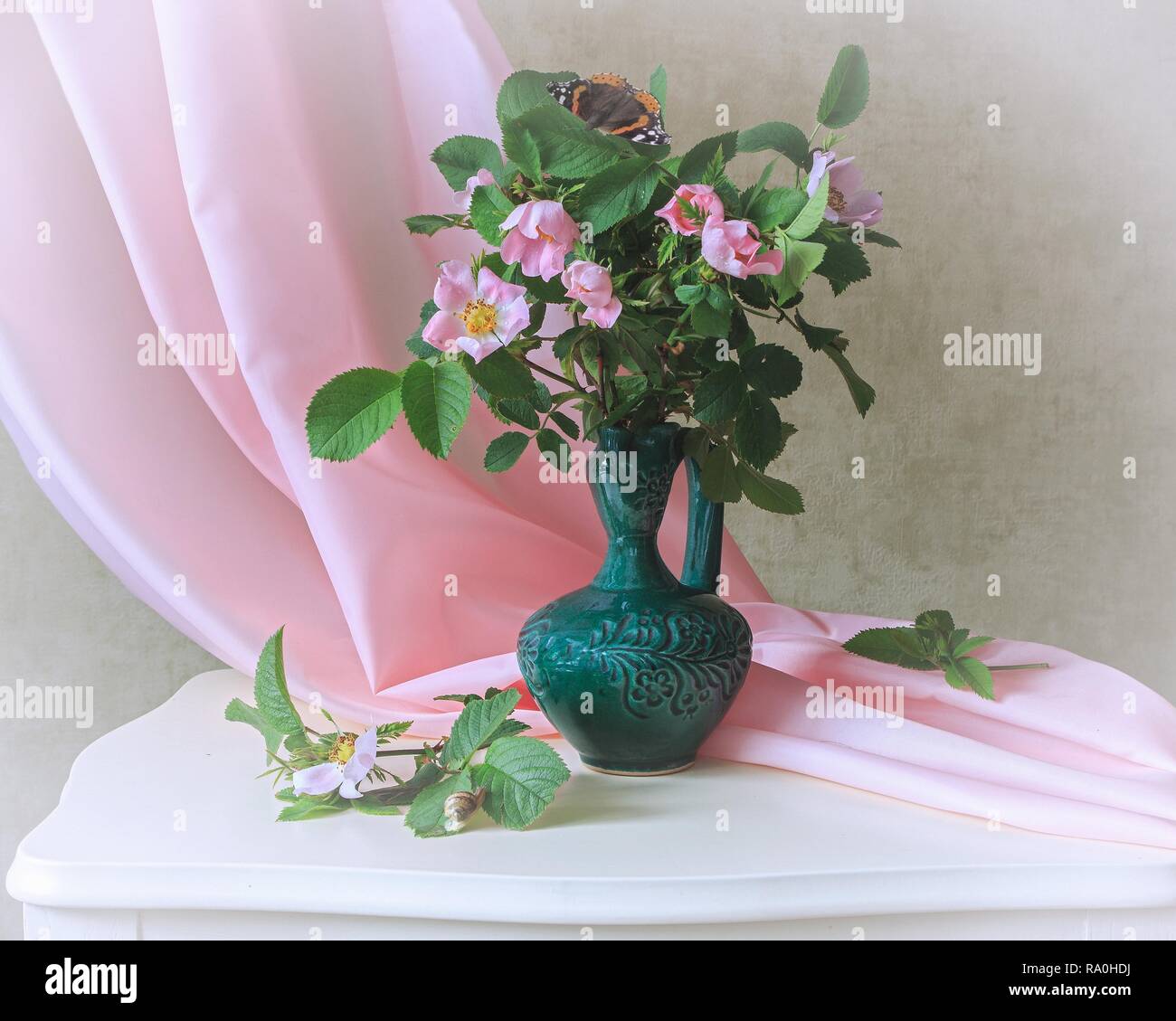 Still life with bouquet of pink wild roses Stock Photo - Alamy