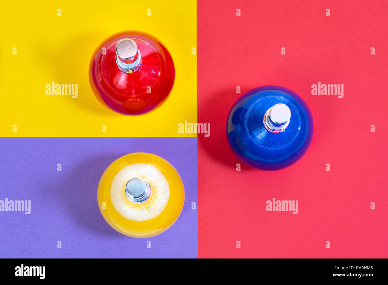 some glass bottles containing colored liquid Stock Photo