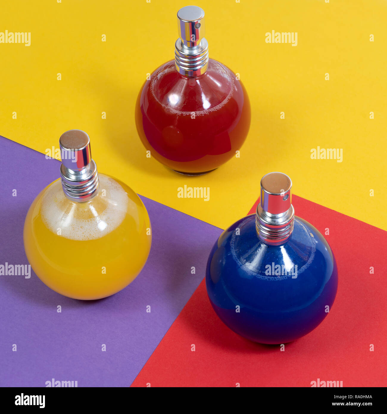 some glass bottles containing colored liquid Stock Photo