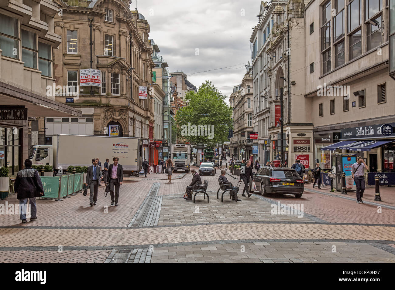 Pedestrianised New Street in the City of Birmingham, England, showing shops and pedestrian walkways. Stock Photo