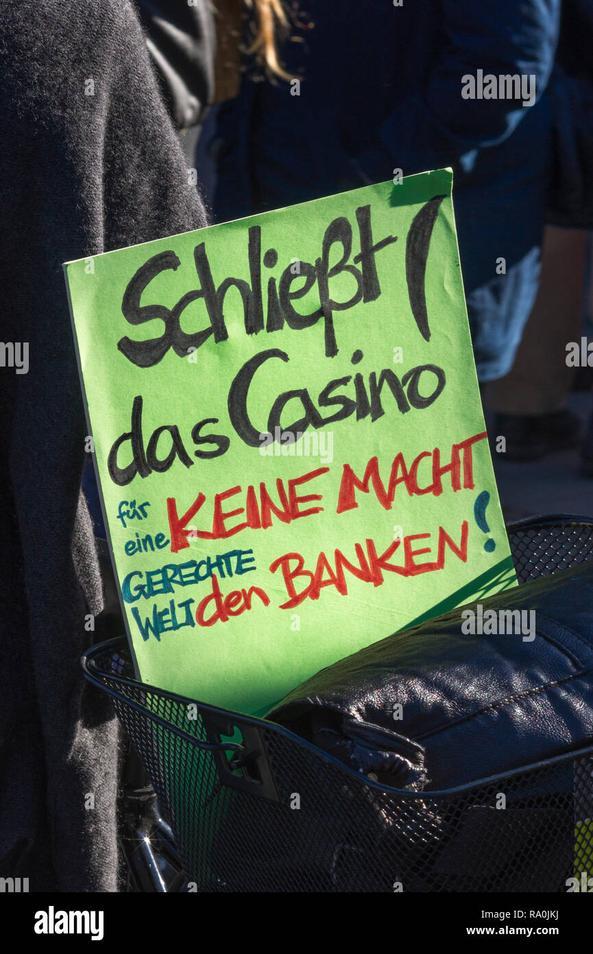 sign saying  'close the casino. no power for the banks. for a just world' ; demonstration against financial speculation Stock Photo