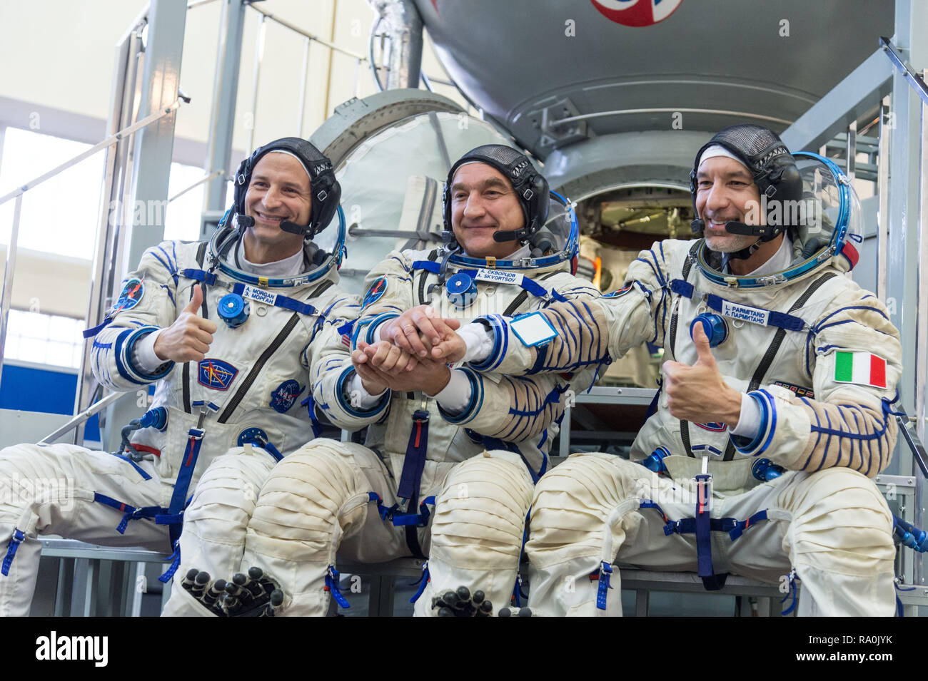 International Space Station Expedition 58 backup crew members Drew Morgan of NASA, left, Alexander Skvortsov of Roscosmos, center, and Luca Parmitano of the European Space Agency pose outside the Soyuz simulator at the Gagarin Cosmonaut Training Center November 13, 2018 in Star City, Russia. Stock Photo