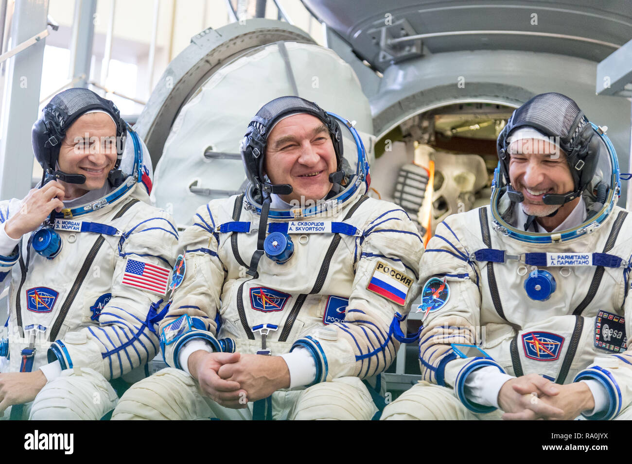 International Space Station Expedition 58 backup crew members Drew Morgan of NASA, left, Alexander Skvortsov of Roscosmos, center, and Luca Parmitano of the European Space Agency pose outside the Soyuz simulator at the Gagarin Cosmonaut Training Center November 13, 2018 in Star City, Russia. Stock Photo