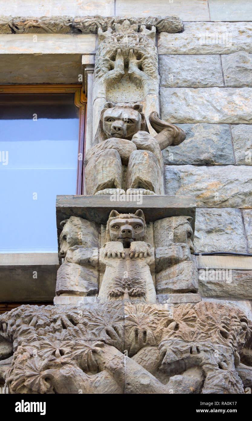 HELSINKI, Finland - July 23, 2013: Wall sculpture with bears on the exterior of a historic building Stock Photo