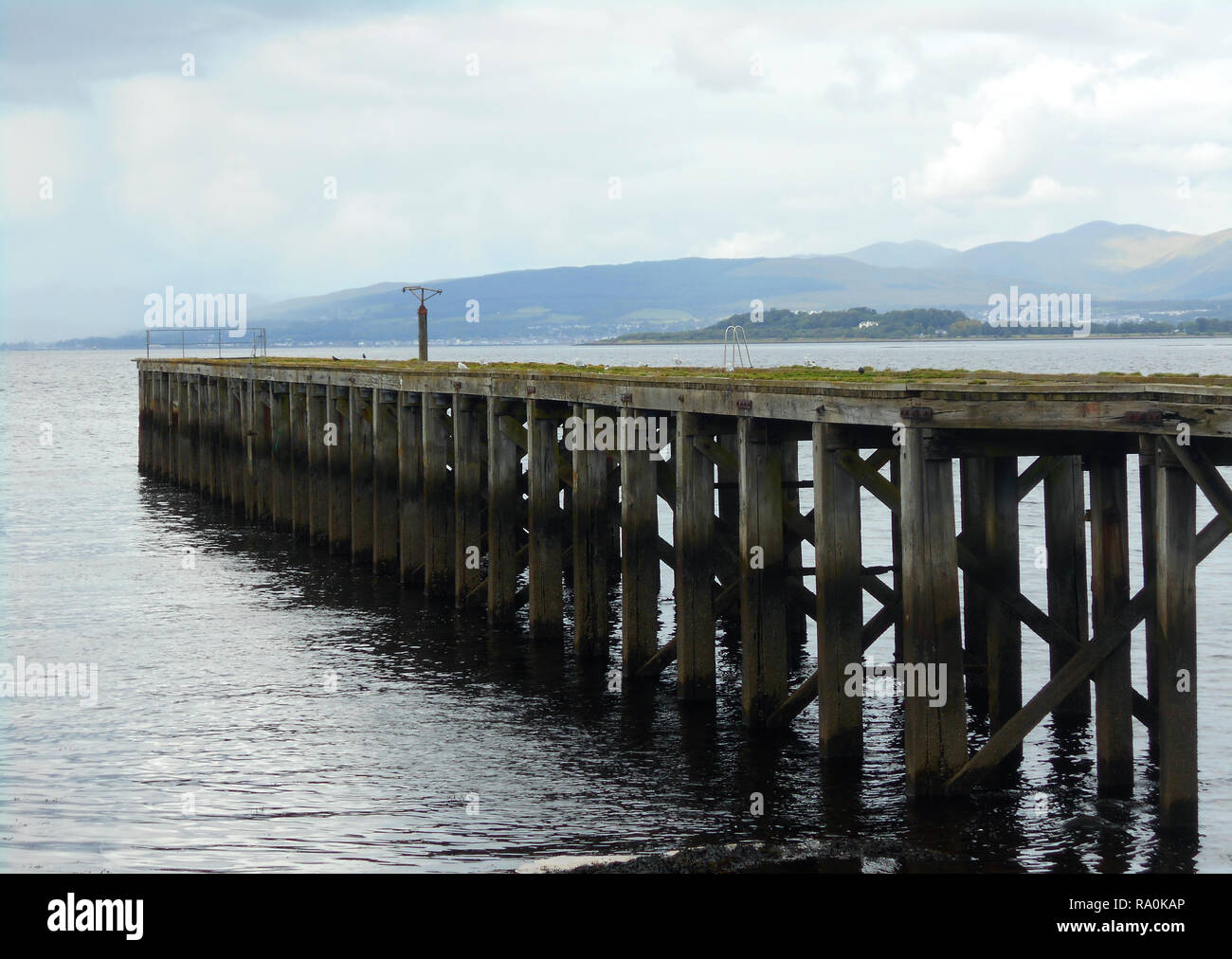 A lonely, forlorn and abandoned pier juts out into the Firth of Clyde near the small Clyde coast town of Port Glasgow in Scotland. Alan Wylie/ALAMY © Stock Photo