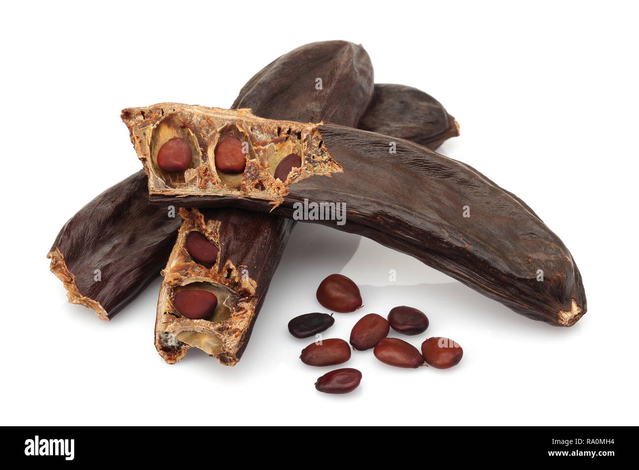 Ripe carob pods and seeds isolated on white background Stock Photo Alamy