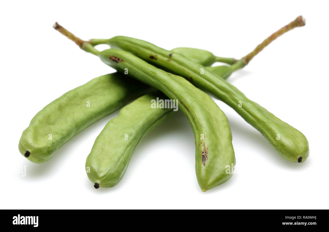 Green carob pods isolated on white background Stock Photo Alamy