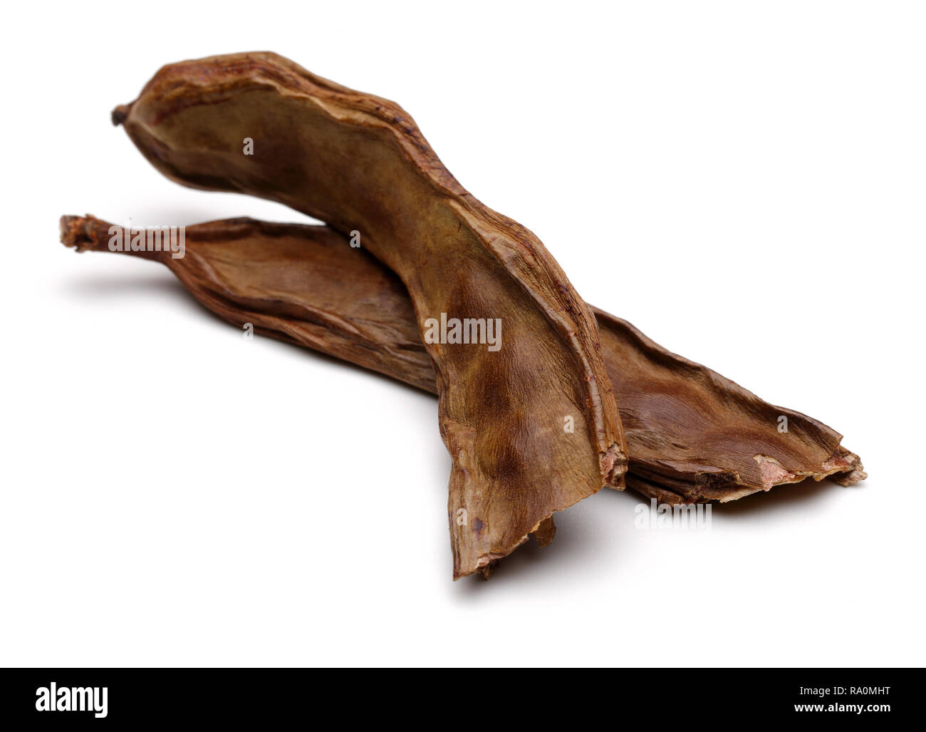 Ripe carob pods isolated on white background Stock Photo Alamy