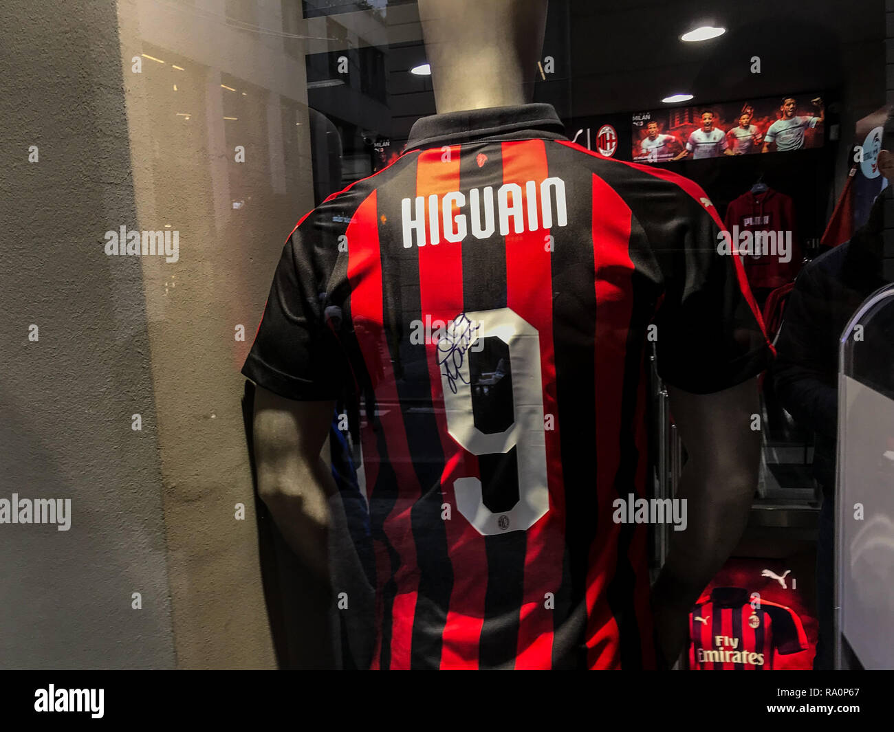 The t-shirt of Ronaldo and Gonzalo Higuain are shown in a football shop in Milano Stock Photo