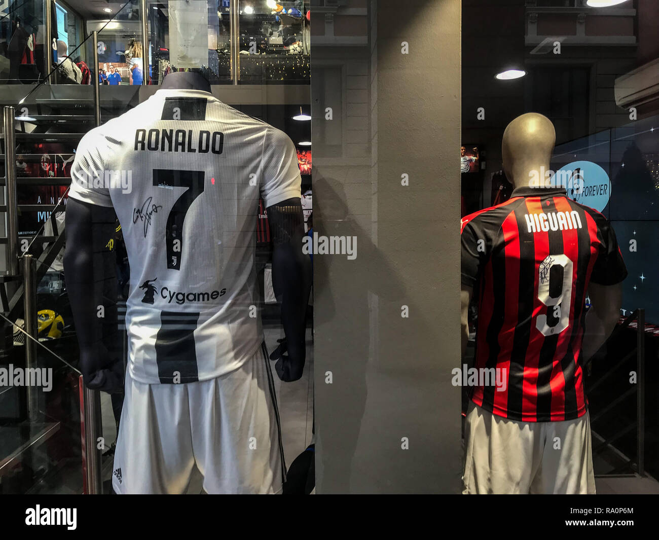 The t-shirt of Ronaldo and Gonzalo Higuain are shown in a football shop in Milano Stock Photo