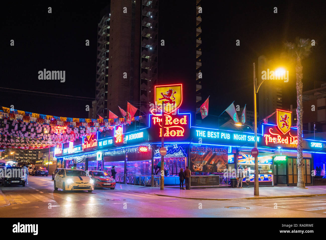 The Red Lion Pub in the Town, Benidorm, Alicante Province, Spain lit at night Stock Photo - Alamy