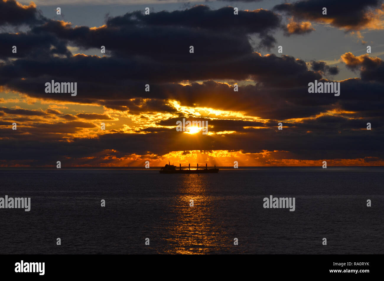 Ship in Ocean Sunset Stock Photo Alamy
