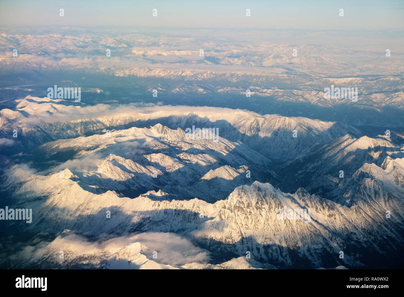The Cascade Mountains in the Pacific Northwest (Seattle, Washington, USA); snowy peaks from above. Stock Photo