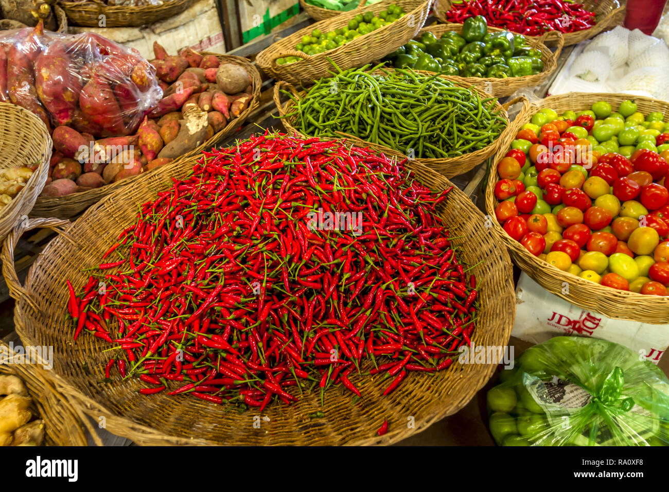 Asian Market of baskets of vegetables for sale. Large array of