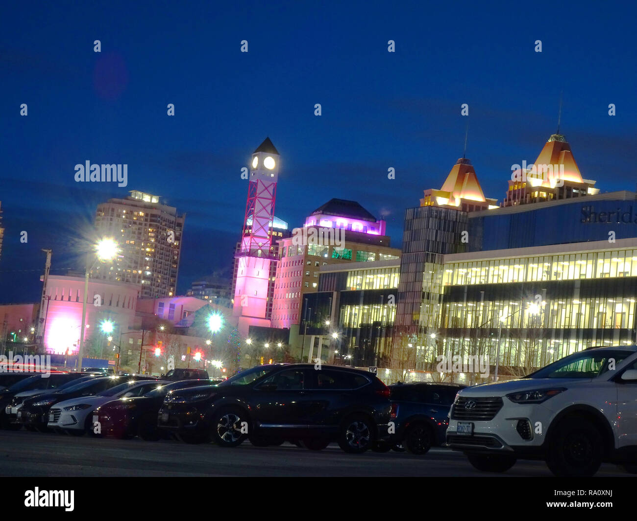 Various shots of Toronto taken during the blue hour. The blue sky is contrasted against the warm glow of the city's lights. Stock Photo