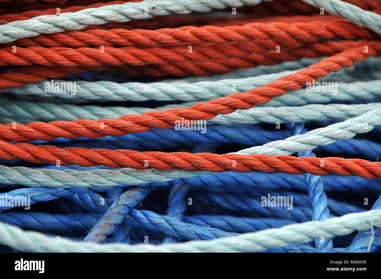 Detail of blue and orange boating mooring rope / ropes Stock Photo