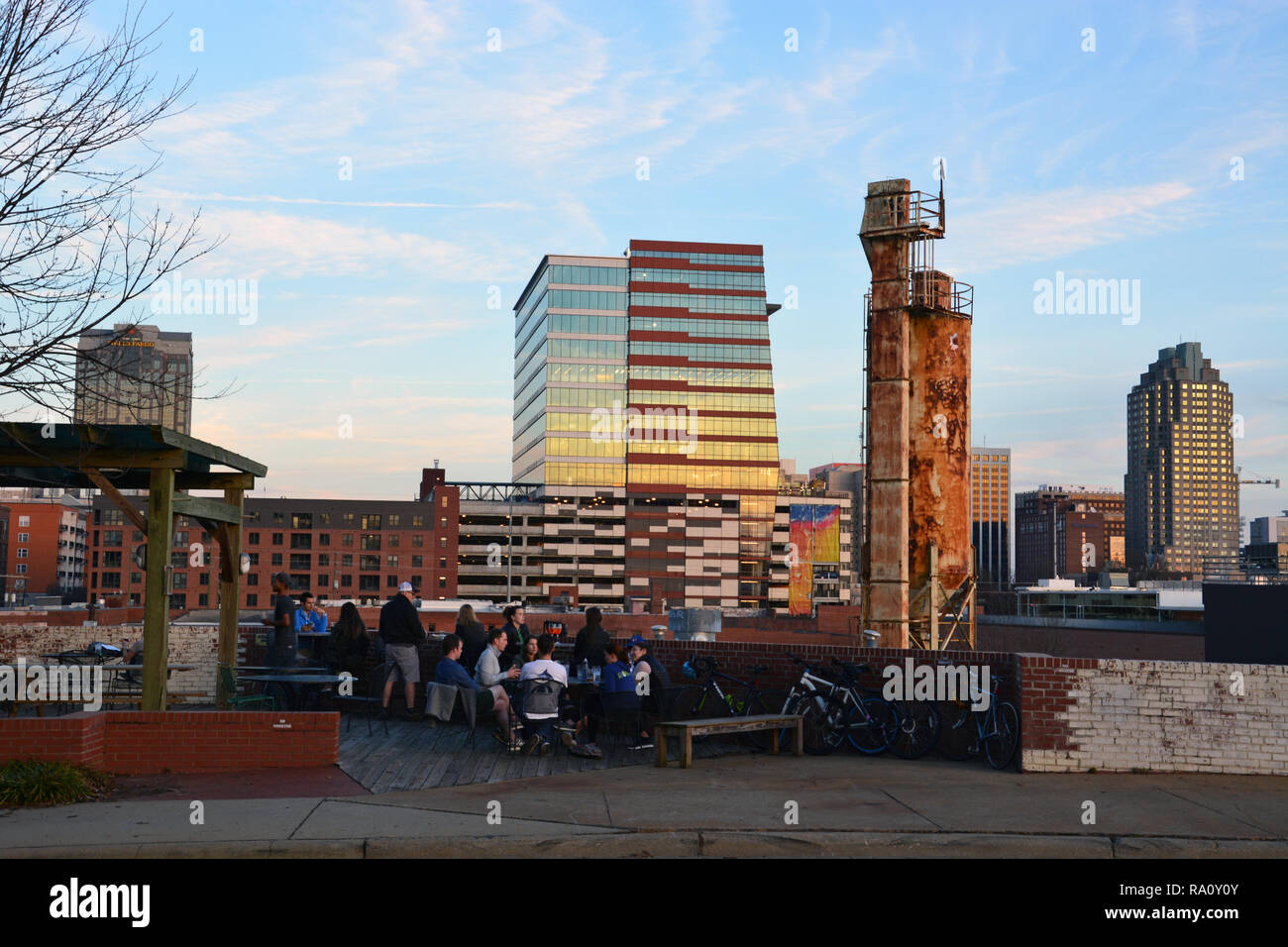 The Raleigh Nc Skyline Is In The Background Of The Beer Garden At