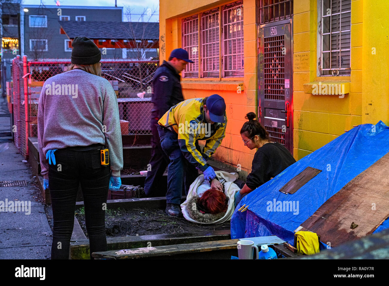 Paramedic attends to drug overdose victim, Downtown Eastside, Vancouver