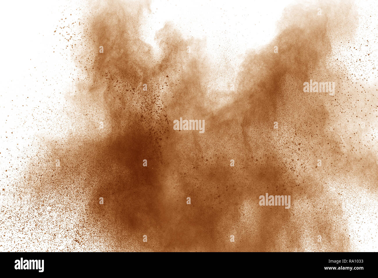 Brown powder explosion on white background. Stock Photo