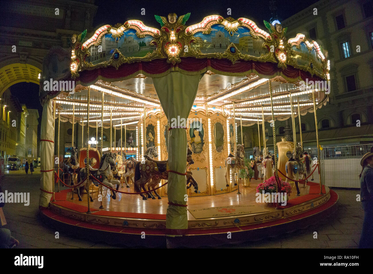 Horse carousel at Florence fairground Stock Photo