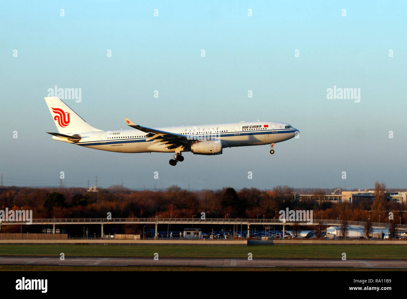 Air China Airbus A330-200 landing at Heathrow Airport, London UK, Terminal 5 runway. Stock Photo