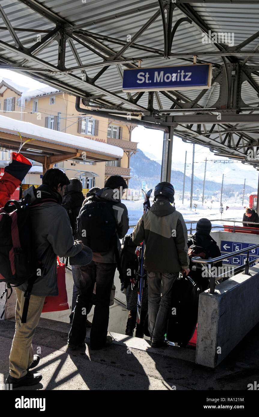 Passngers and skiers arriving at St. Moritz  rail station in Switzerland Stock Photo