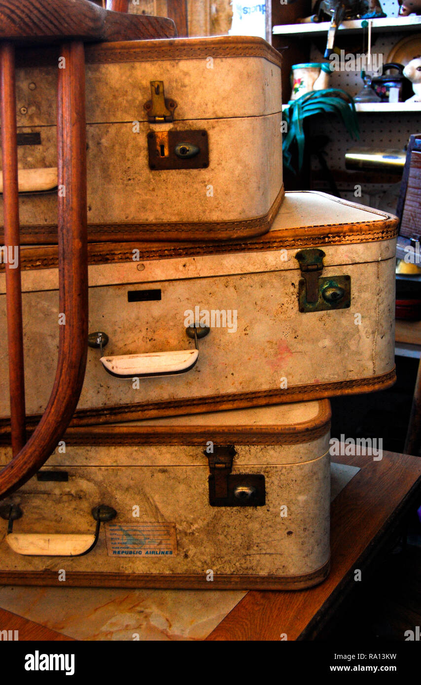 A stack of vintage suitcases sits on a desk Jan. 9, 2011 at the Antique Mall of Meridian in Meridian, Mississippi. Stock Photo