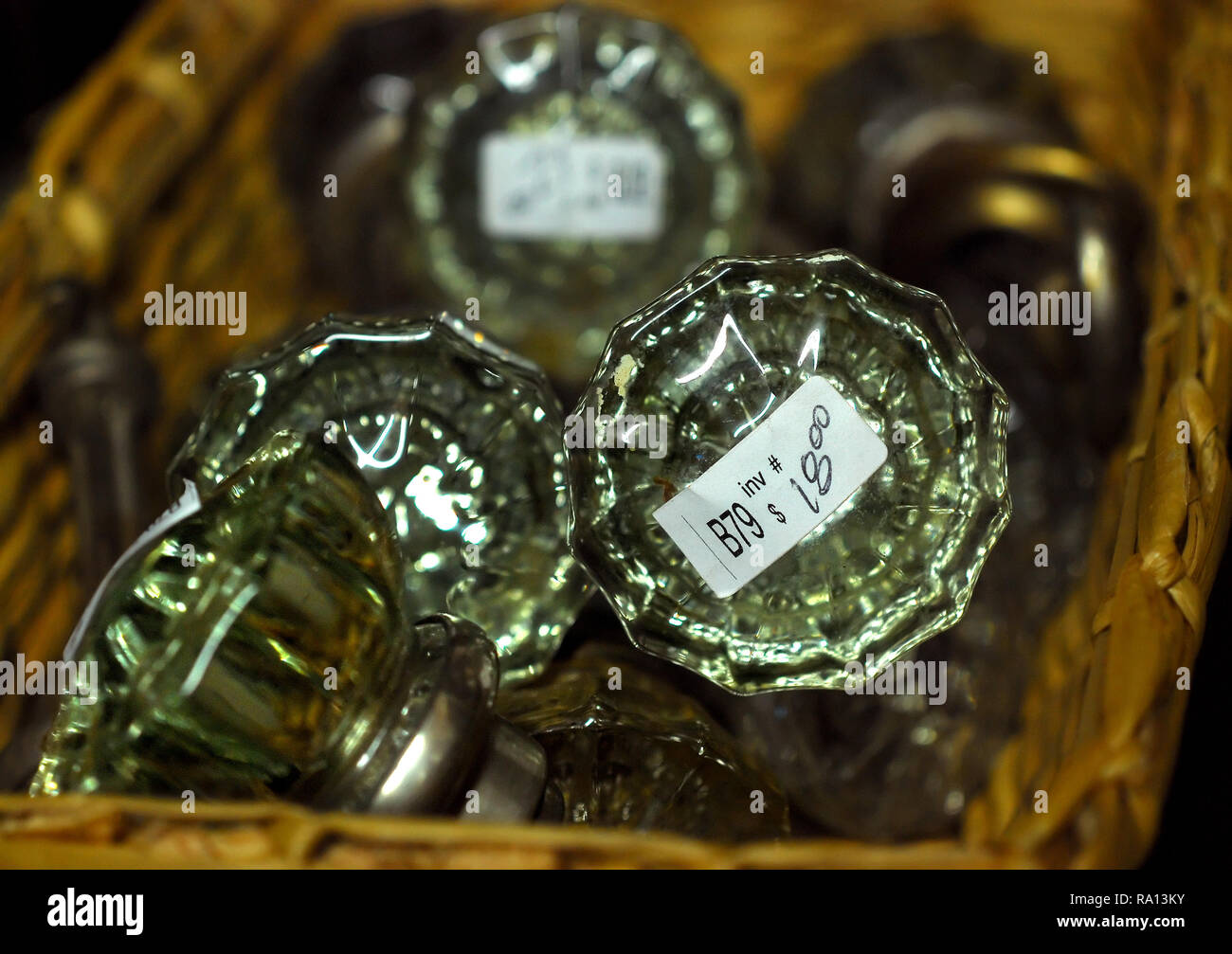 Vintage glass door knobs are displayed in a straw basket on Jan. 9, 2011 at the Antique Mall of Meridian in Meridian, Mississippi. Stock Photo