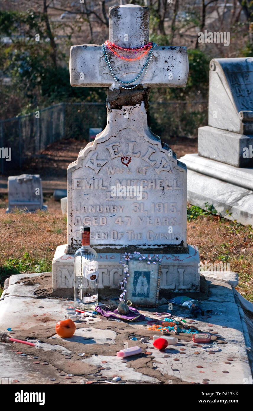 Mardi Gras beads decorate the headstone of gypsy queen Kelly Mitchell at Rose Hill Cemetery in Meridian, Mississippi. Stock Photo