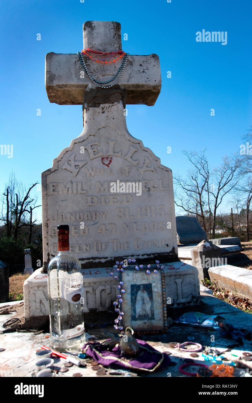 Mardi Gras beads decorate the headstone of gypsy queen Kelly Mitchell at Rose Hill Cemetery in Meridian, Mississippi. Stock Photo
