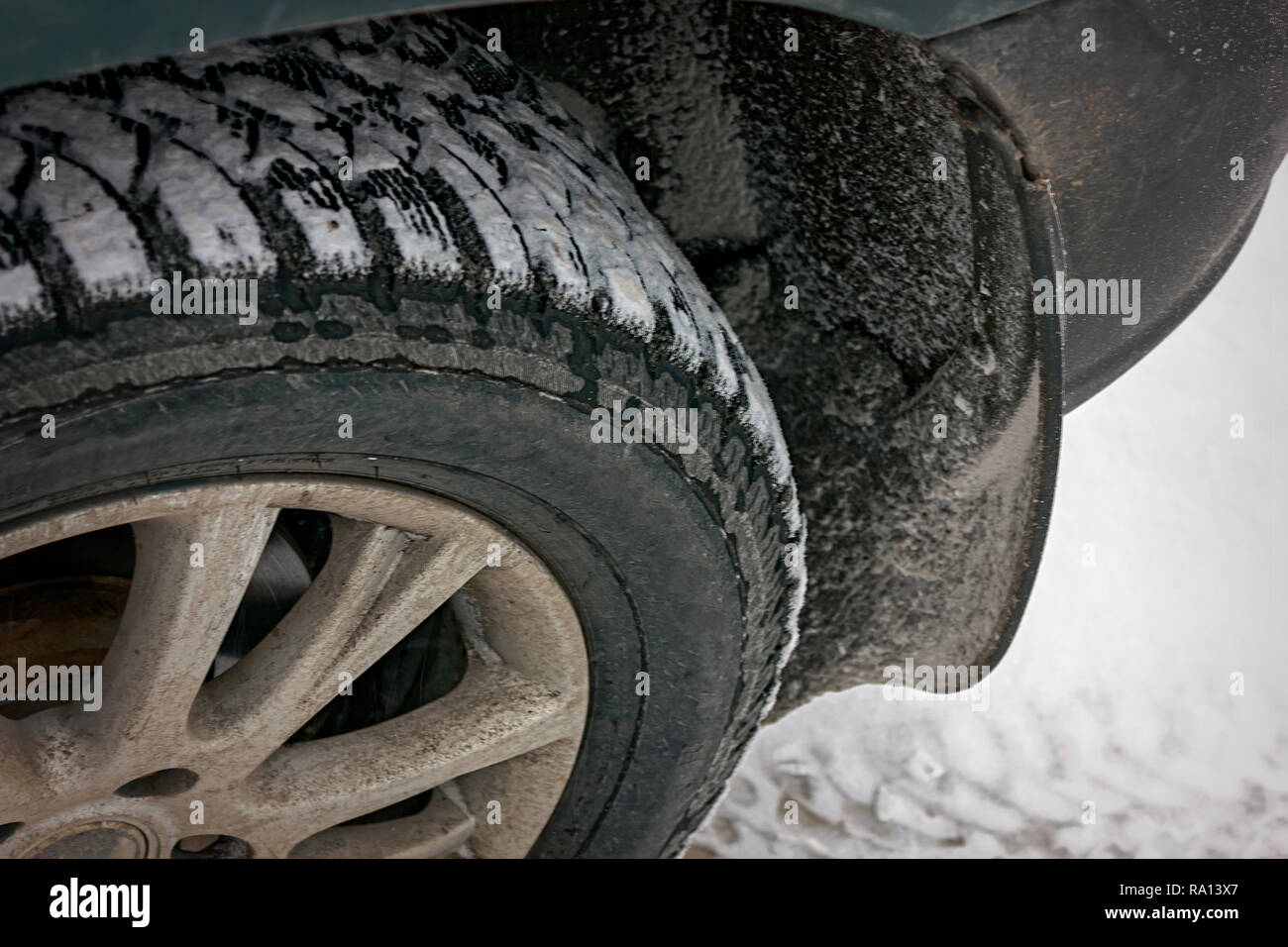 winter studded tire on a car with sticking snow Stock Photo Alamy
