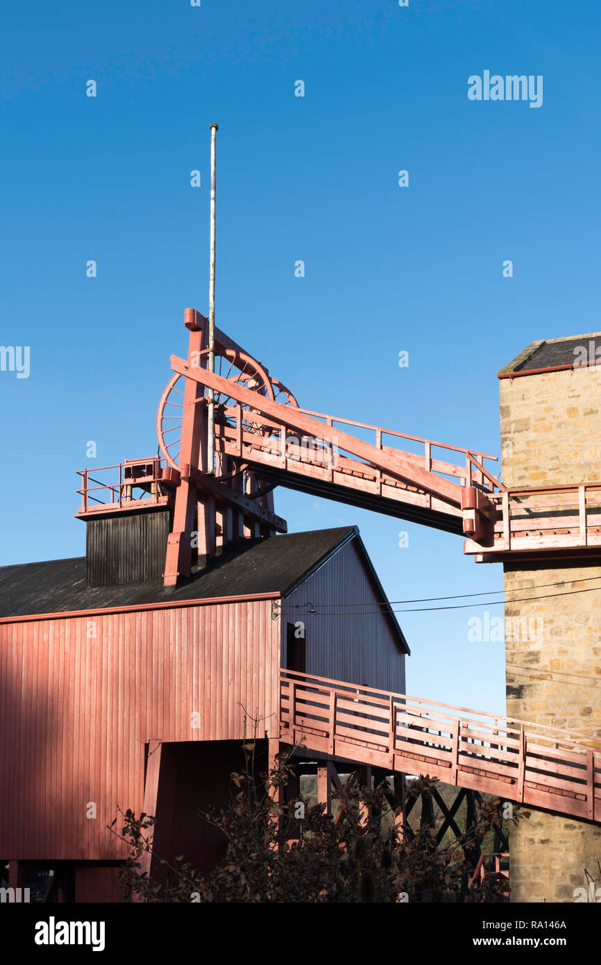 The wooden colliery heapstead or pit head with winding wheels at Beamish Museum, north east England, UK Stock Photo