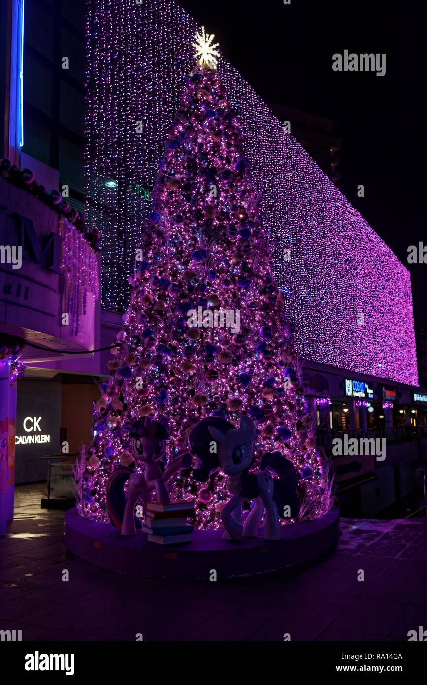 Christmas tree lit up along Orchard Road, Singapore, with the Disney theme Stock Photo