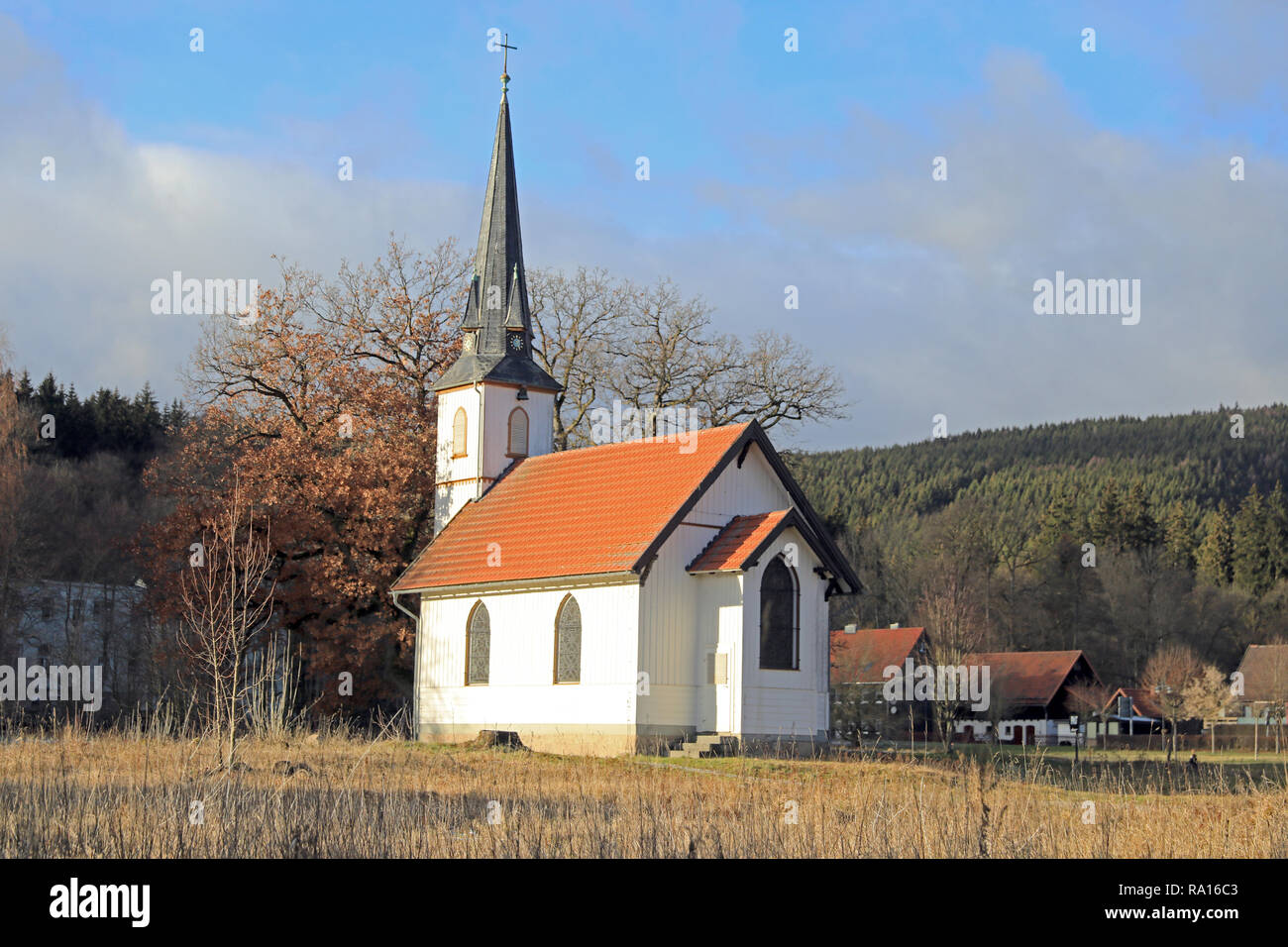 Elend, Germany. 11th Dec, 2018. In the middle of the densely wooded Harz region in Elend stands the probably smallest wooden church in Germany. Actually, it is a half-timbered church in neo-Gothic style and offers space for a maximum of 90 people in the 60 square metre interior. Despite its size, the church is decorated with colourful windows and has its own bell, in addition to the altar and organ. This is still rung by hand. Credit: Peter Gercke/dpa-Zentralbild/ZB/dpa/Alamy Live News Stock Photo