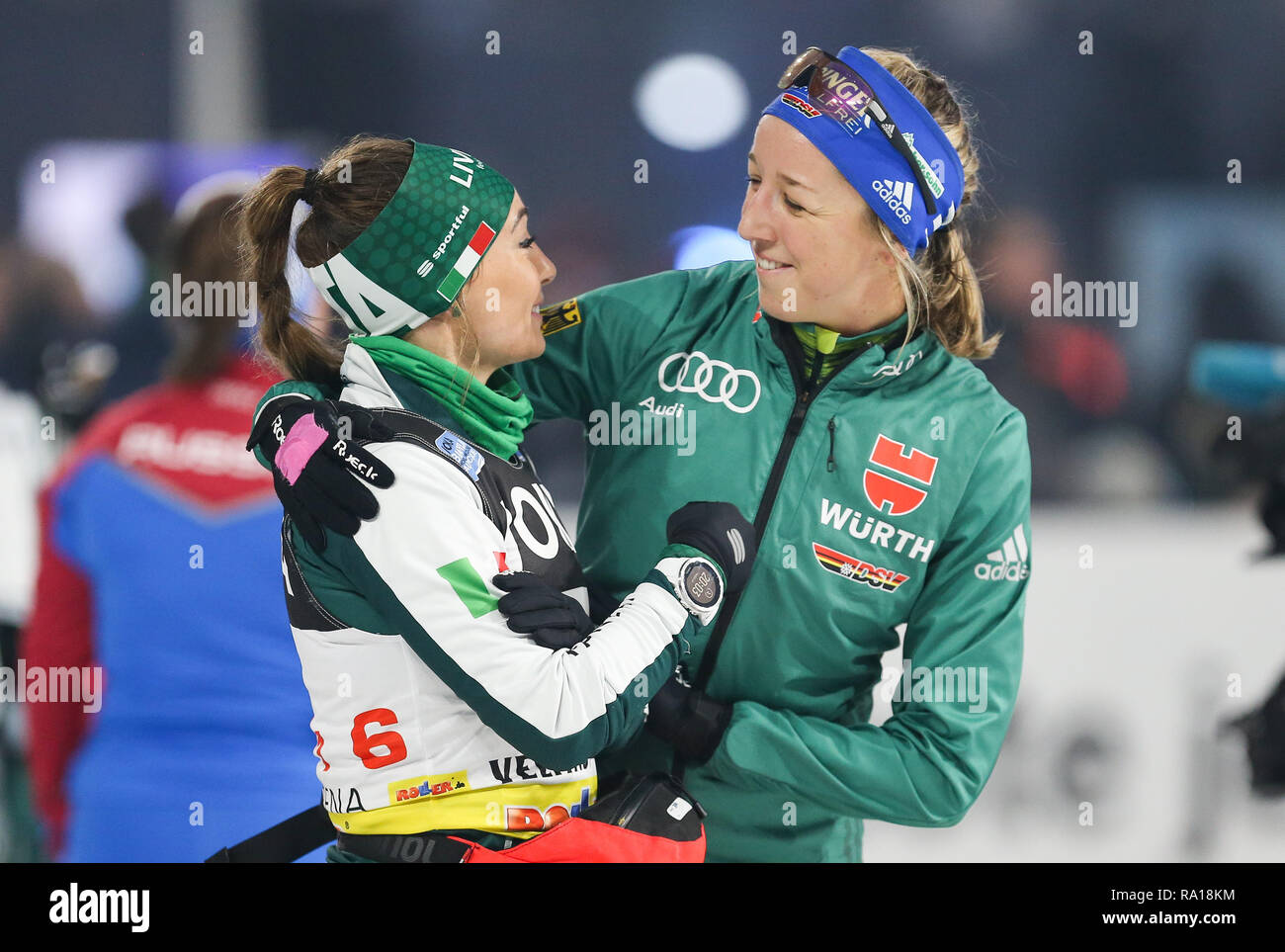 Gelsenkirchen, Germany. 29th Dec, 2018. The Italian biathlete Dorothea  Wierer (l) and the German biathlete Franziska Preuß (r) are delighted at  the 17th Biathlon World Team Challenge (WTC) in the Veltins Arena.