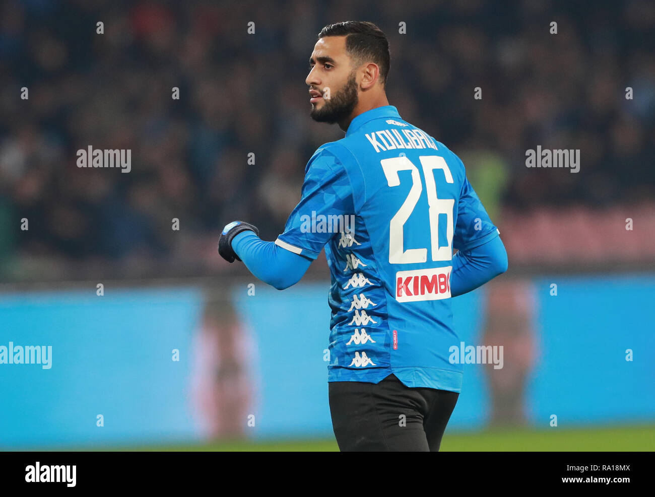 Stadio San Paolo, Naples, Italy. 29th Dec, 2018. Serie A football, Napoli versus Bologna; Faouzi Ghoulam of Napoli with the shirt of Kalidou Koulibaly Credit: Action Plus Sports/Alamy Live News Stock Photo