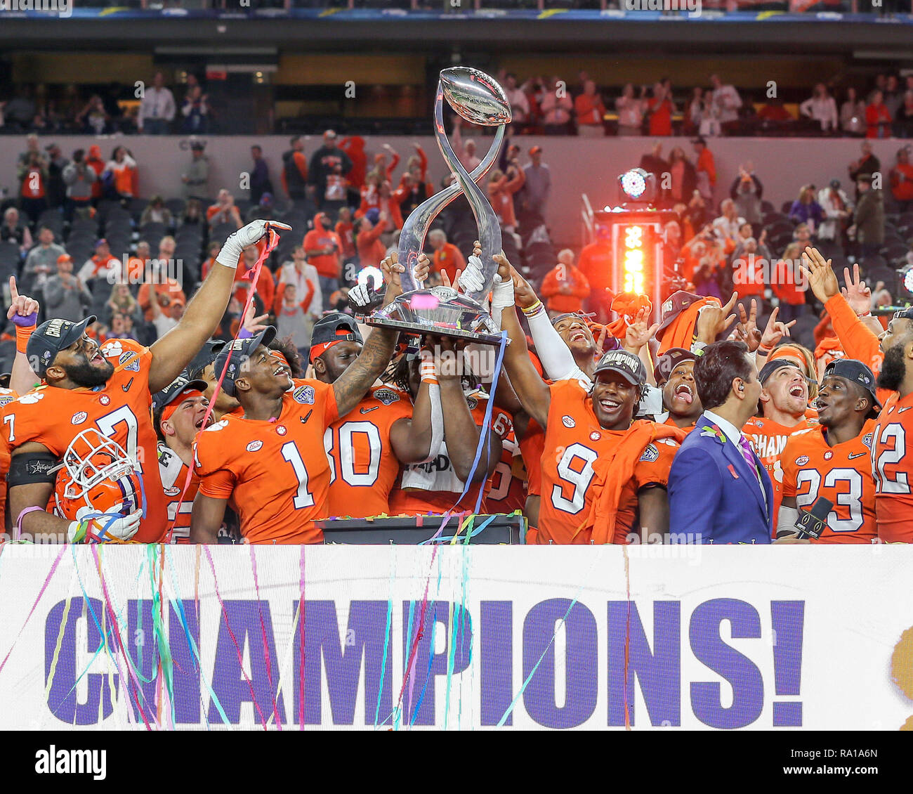 Arlington, TX, USA. 29th Dec, 2018. Clemson running back Travis Etienne (9) and Clemson wide receiver Trevion Thompson (1) lift the Field Scovell Trophy after winning the Cotton Bowl NCAA Football game between the Clemson Tigers and the Notre Dame Fighting Irish at AT&T Stadium in Arlington, TX. Tom Sooter/CSM/Alamy Live News Stock Photo
