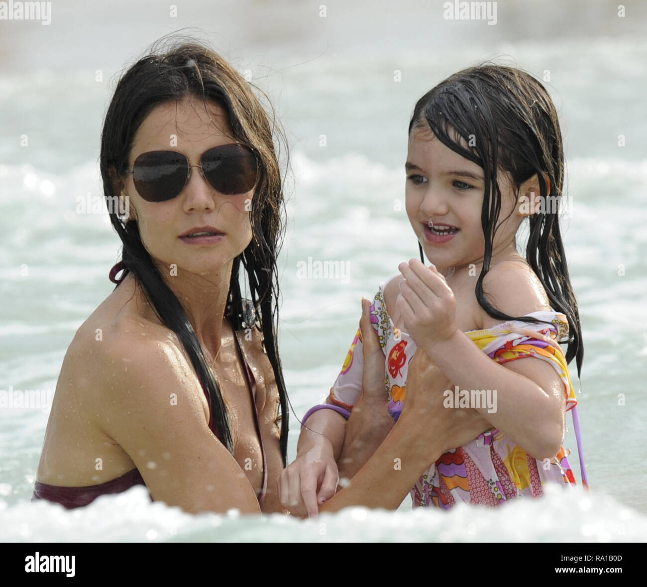 MIAMI BEACH, FL - JUNE 18: Katie Holmes and Suri Cruise had a fun day out  on beach today in Miami, outside their hotel. The famous mother and  daughter pair played in