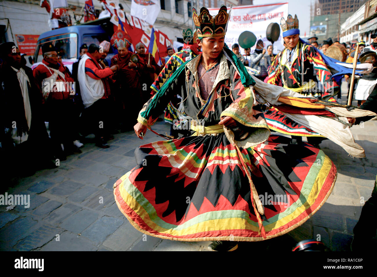 Nepalese men from ethnic Gurung community in traditional attire dance as they take part in parade to mark their New Year also known as Tamu Losar. The indigenous Gurungs, also known as Tamu, are celebrating the advent of the year of the deer. Stock Photo