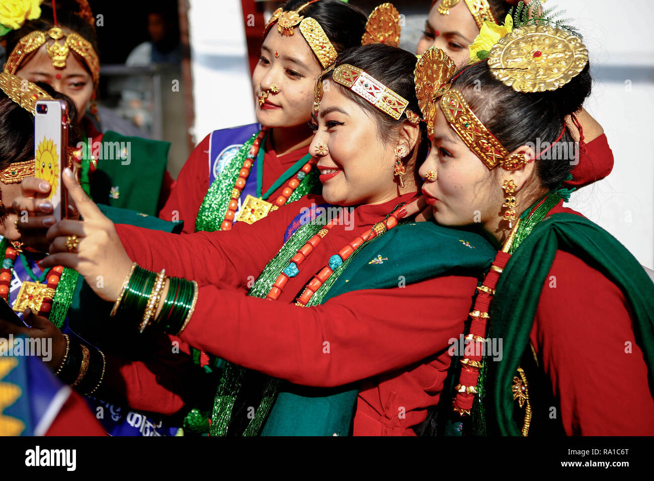 nepalese women from ethnic gurung community in traditional attire take photos as they take part in parade to mark their new year also known as tamu losar the indigenous gurungs also known as tamu are celebrating the advent of the year of the deer RA1C6T