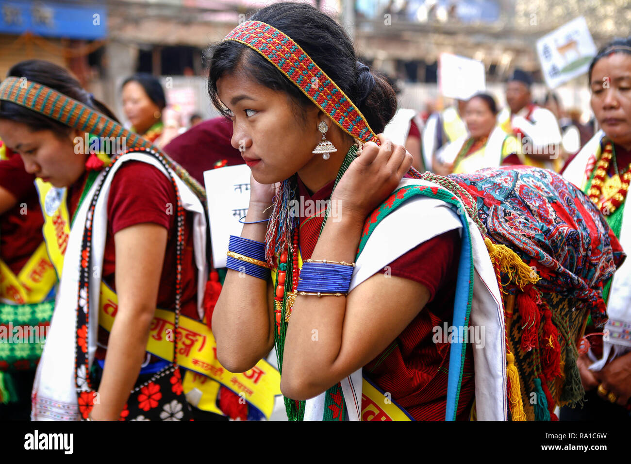 Nepalese women from ethnic Gurung community in traditional attire take part in parade to mark their New Year also known as Tamu Losar. The indigenous Gurungs, also known as Tamu, are celebrating the advent of the year of the deer. Stock Photo