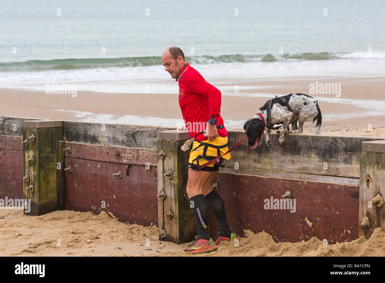 Bournemouth, Dorset, UK. 30th December 2018. Participants take part in the Beach Race, Race the Tide, a low tide beach run along the beautiful shoreline of Bournemouth beach towards Sandbanks beach. Runners run the 5k or 10k race along the seashore and over the groynes before the tide comes in - good exercise after the excesses of Christmas! Credit: Carolyn Jenkins/Alamy Live News Stock Photo