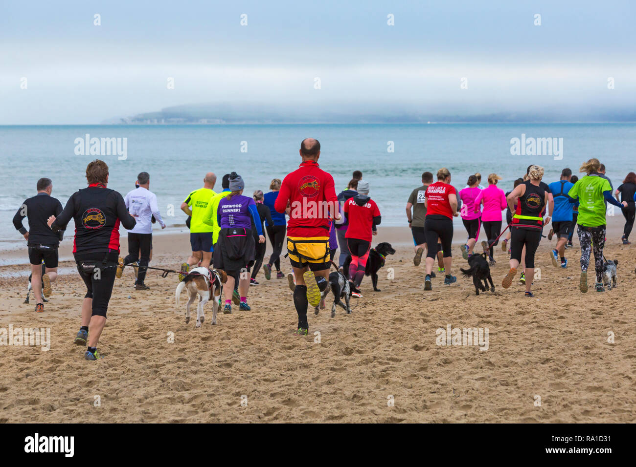 Bournemouth, Dorset, UK. 30th December 2018. Participants take part in the Beach Race, Race the Tide, a low tide beach run along the beautiful shoreline of Bournemouth beach towards Sandbanks beach. Runners run the 5k or 10k race along the seashore and over the groynes before the tide comes in - good exercise after the excesses of Christmas! Credit: Carolyn Jenkins/Alamy Live News Stock Photo
