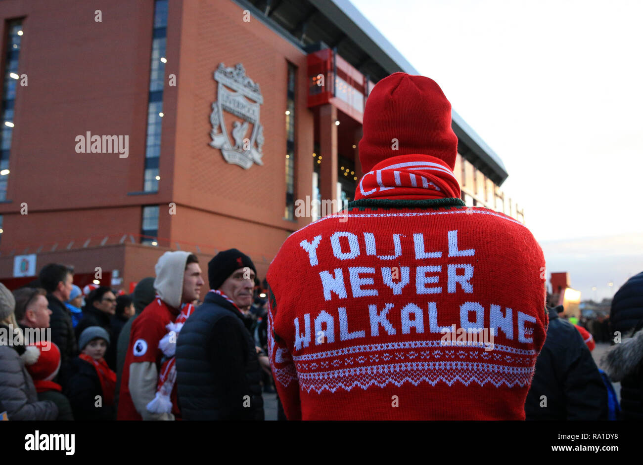 Liverpool, UK. 29th Dec 2018. Editorial use only, license required for commercial use. No use in betting, games or a single club/league/player publications.  EPL Premier League football, Liverpool versus Arsenal; a Liverpool fan wearing a 'You'll Never Walk Alone' sweater awaits the arrival of the team buses prior to the match Credit: Action Plus Sports/Alamy Live News Stock Photo