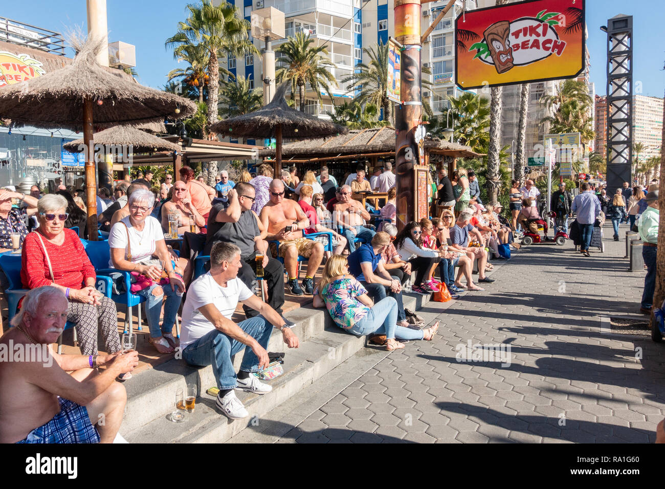 Benidorm, Spain. 30 December 2018. British tourists mix with locals on the beaches and in the bars and restaurants as they escape the cold British weather and head south to Spain. High temperatures meant that the beaches were busy from early morning with families enjoying the calm sea and temps of about 17 Celsius. Hotel occupancy is 90% for the Christmas and New Year period in this popular Spanish resort. Credit: Mick Flynn/Alamy Live News Stock Photo