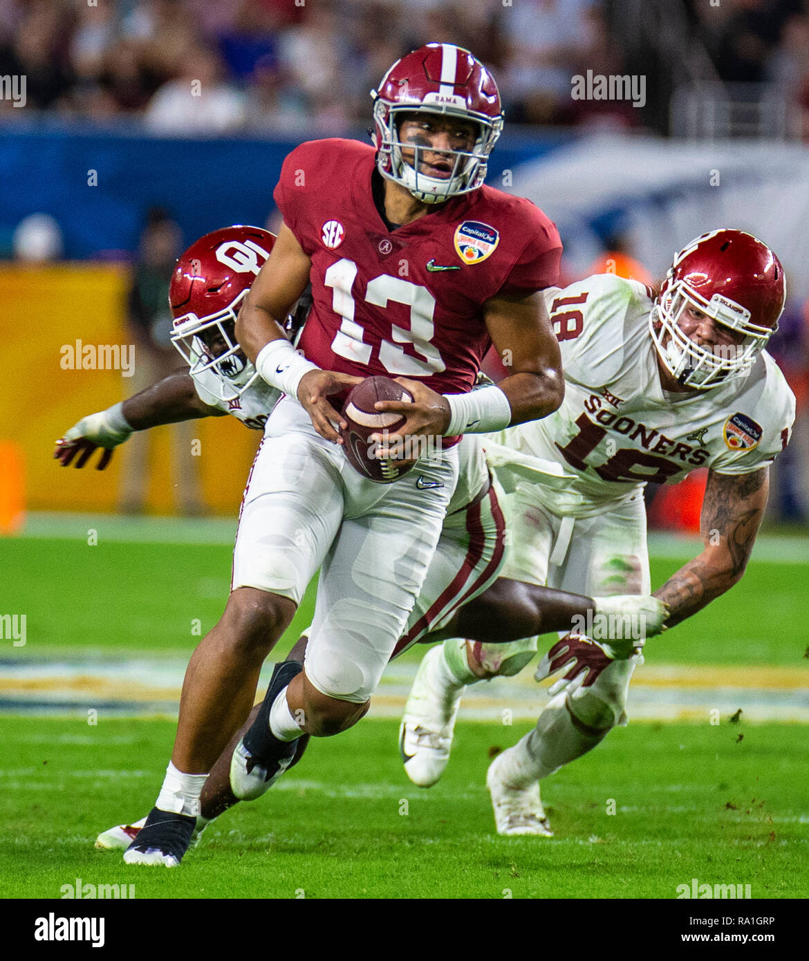 Florida, USA. 29th Dec, 2018. Dec 29 2018 Miami Gardens, FL, U.S.A. Alabama quarterback Tua Tagovailoa (13) game stats 24 for 27 for 318 yards and 4 touchdowns runs in the open field during the NCAA Capital One Orange Bowl Semifinal game between Oklahoma Sooners and the Alabama Crimson Tide 45-34 win at Hard Rock Stadium Miami Gardens, FL Thurman James/CSM Credit: Cal Sport Media/Alamy Live News Stock Photo