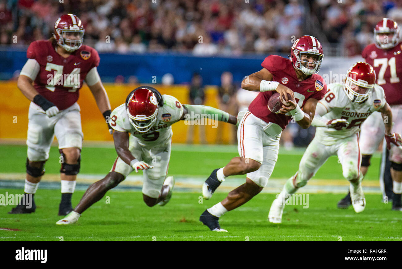 Florida, USA. 29th Dec, 2018. Dec 29 2018 Miami Gardens, FL, U.S.A. Alabama quarterback Tua Tagovailoa (13) game stats 24 for 27 for 318 yards and 4 touchdowns looks down field for an open receiver take off and run during the NCAA Capital One Orange Bowl Semifinal game between Oklahoma Sooners and the Alabama Crimson Tide 45-34 win at Hard Rock Stadium Miami Gardens, FL Thurman James/CSM Credit: Cal Sport Media/Alamy Live News Stock Photo