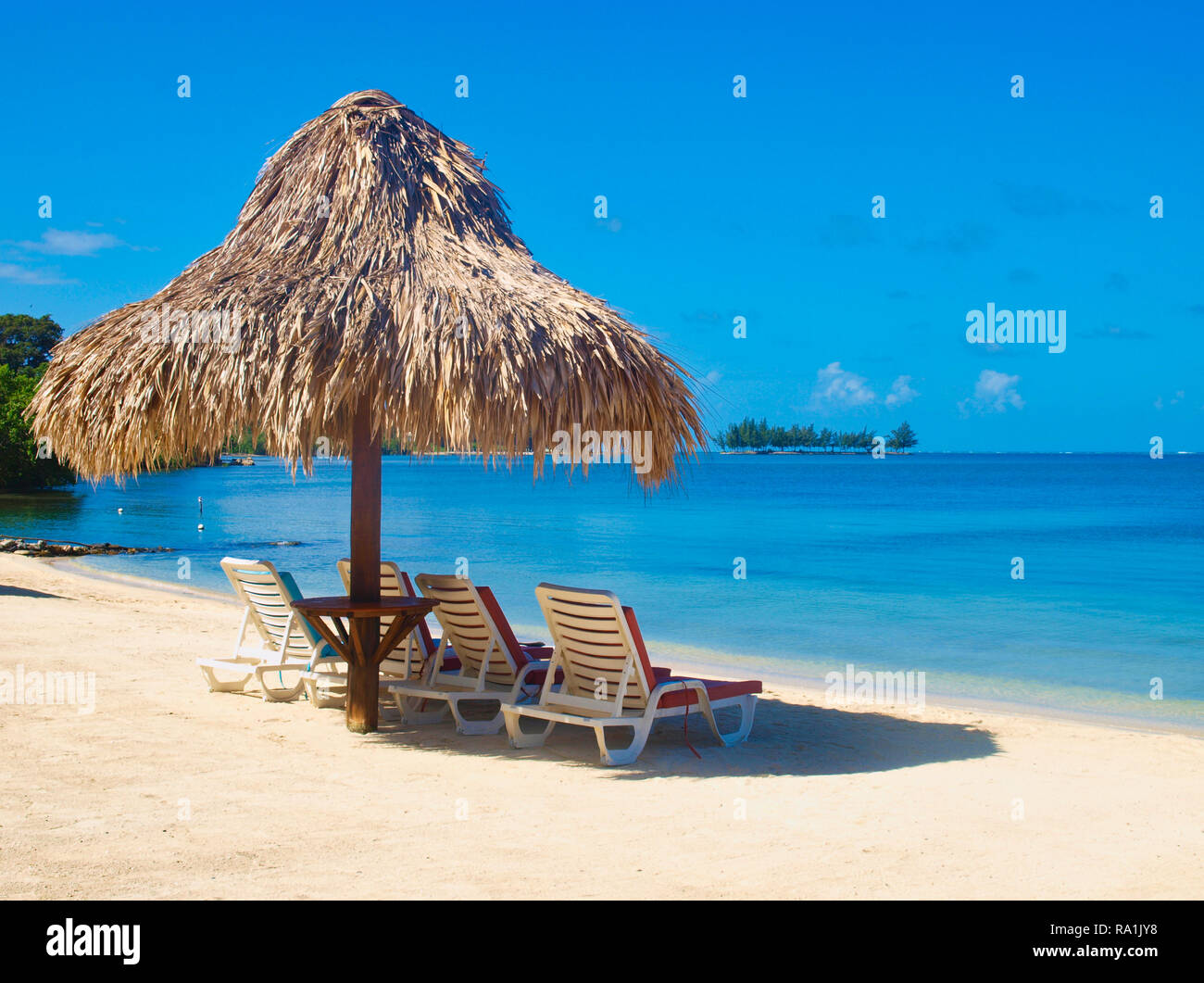 Palapa and Chairs on the beach. Roatan island Stock Photo