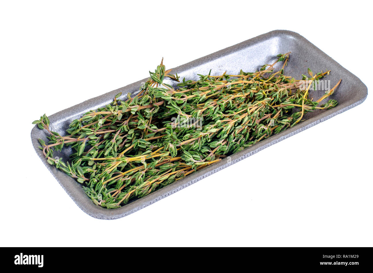 Thyme sprigs, mortar, pestle, herb for cooking. Studio Photo Stock