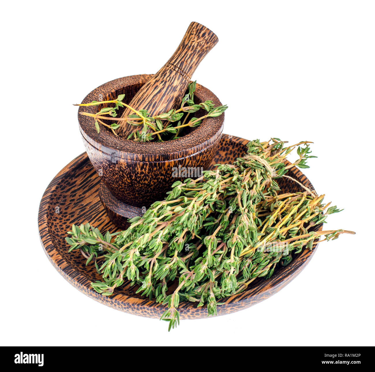 Thyme sprigs, mortar, pestle, herb for cooking. Studio Photo Stock